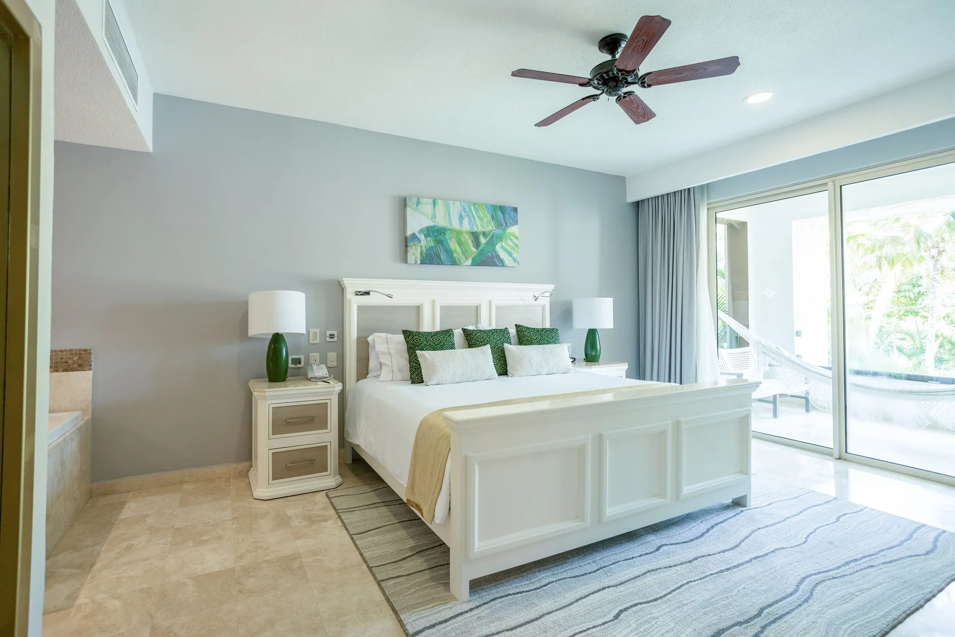 One Bedroom king bed and balcony doors at Villa del Palmar Cancun Beach Resort & Spa.