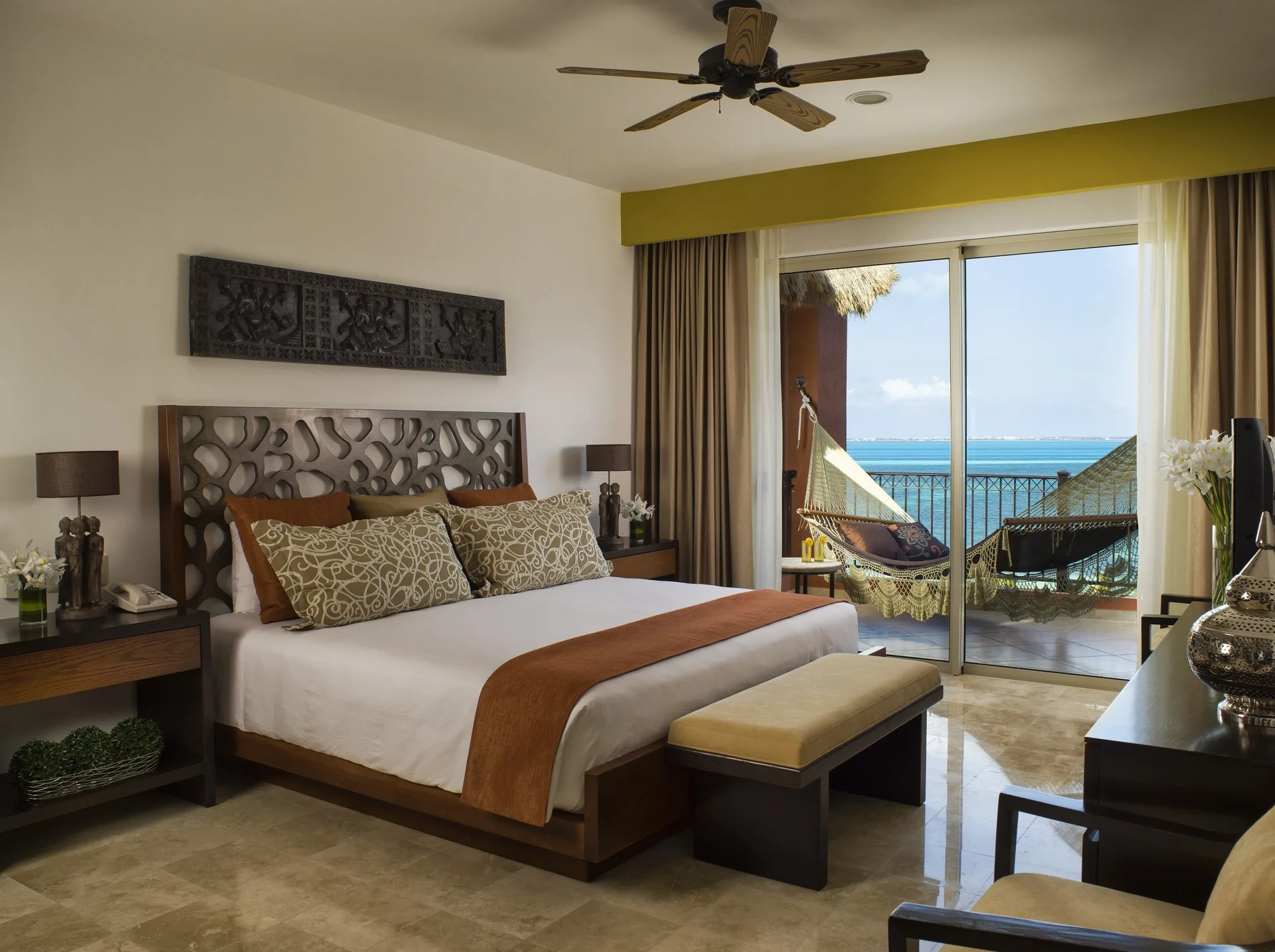 Three Bedroom Loft king bedroom with balcony hammock at Villa del Palmar Cancun Beach Resort & Spa.