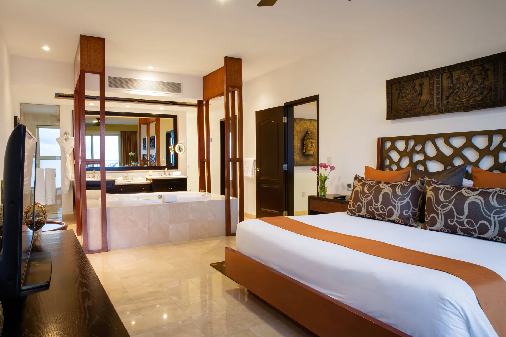 Three Bedroom Loft king bedroom with open bath at Villa del Palmar Cancun Beach Resort & Spa.