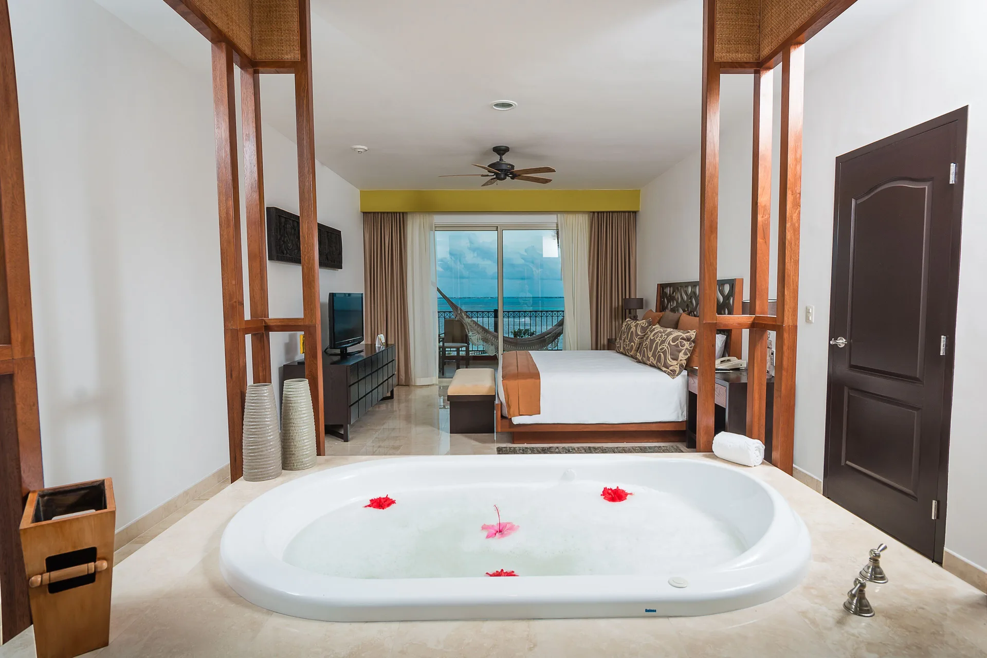 Three Bedroom Loft soaking tub facing king bedroom at Villa del Palmar Cancun Beach Resort & Spa.