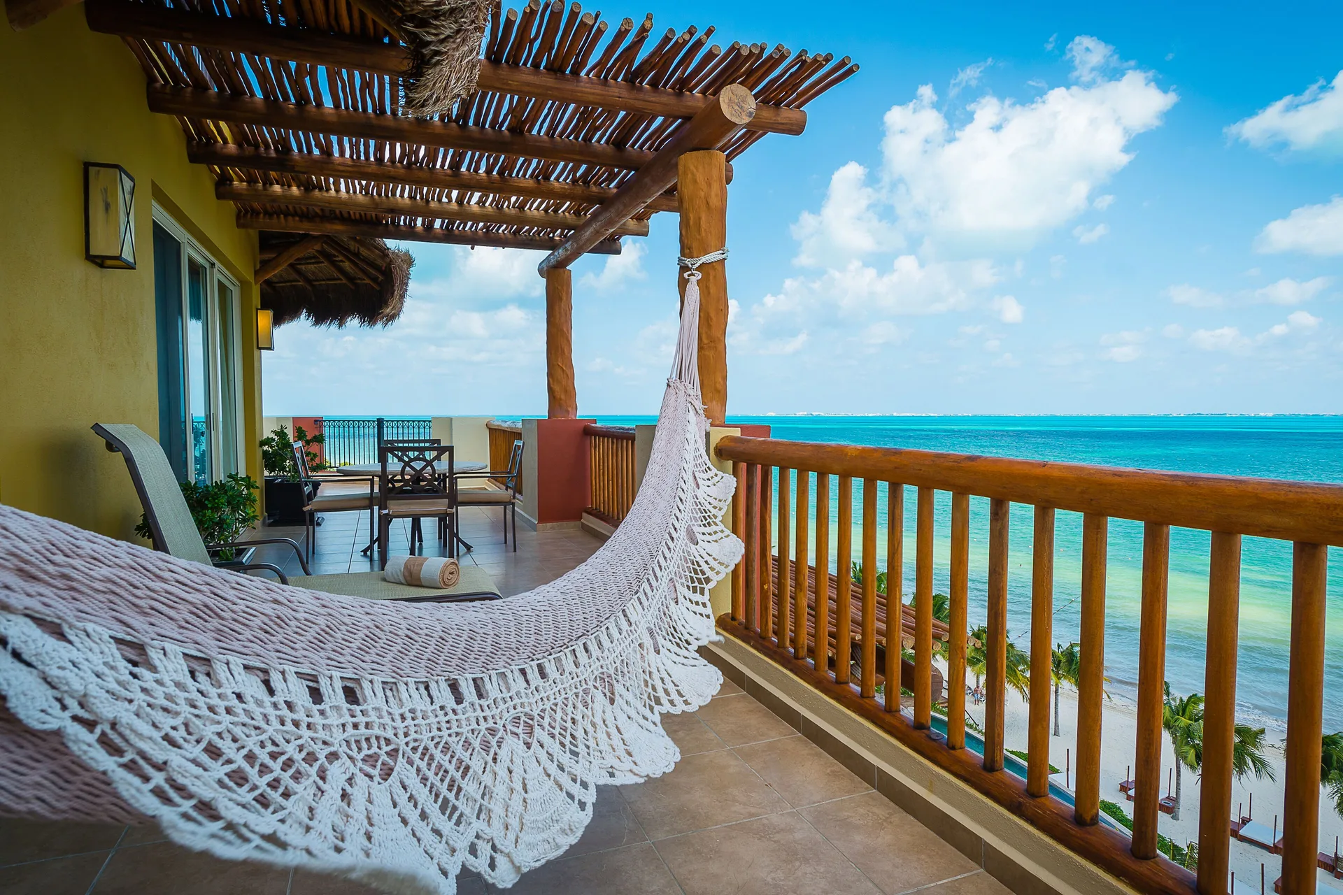 Oceanfront balcony with hammock at Villa del Palmar Cancun Beach Resort & Spa.