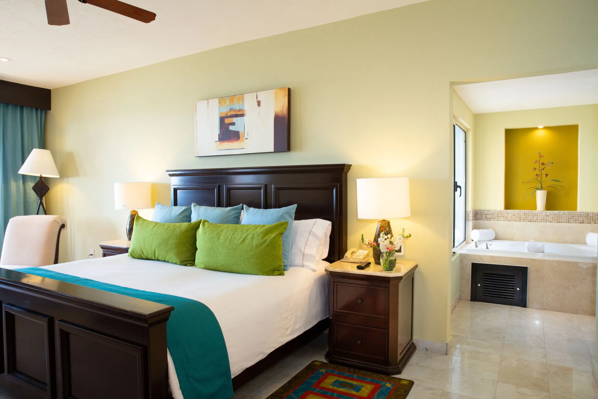 Bedroom with king bed and soaking tub at Villa del Palmar Cancun Beach Resort & Spa.