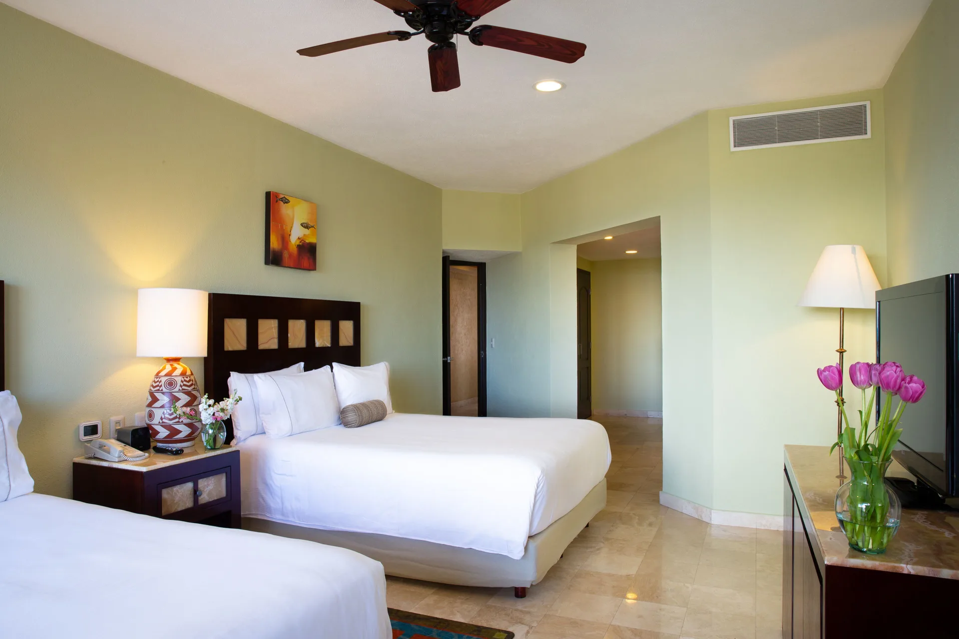 Guest bedroom with two beds at Villa del Palmar Cancun Beach Resort & Spa.