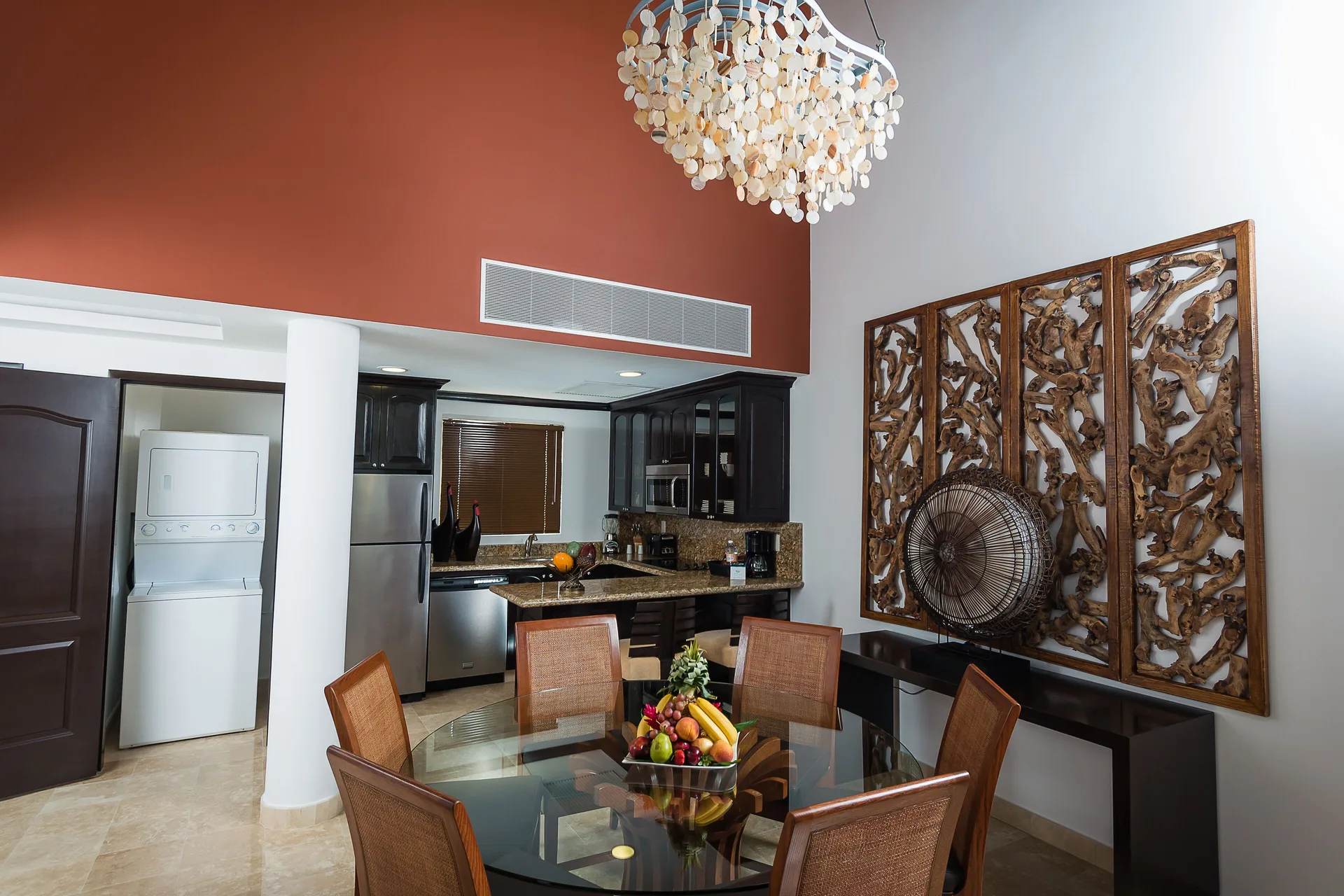 Two Bedroom Loft dining area beside kitchen and laundry closet at Villa del Palmar Cancun Beach Resort & Spa.