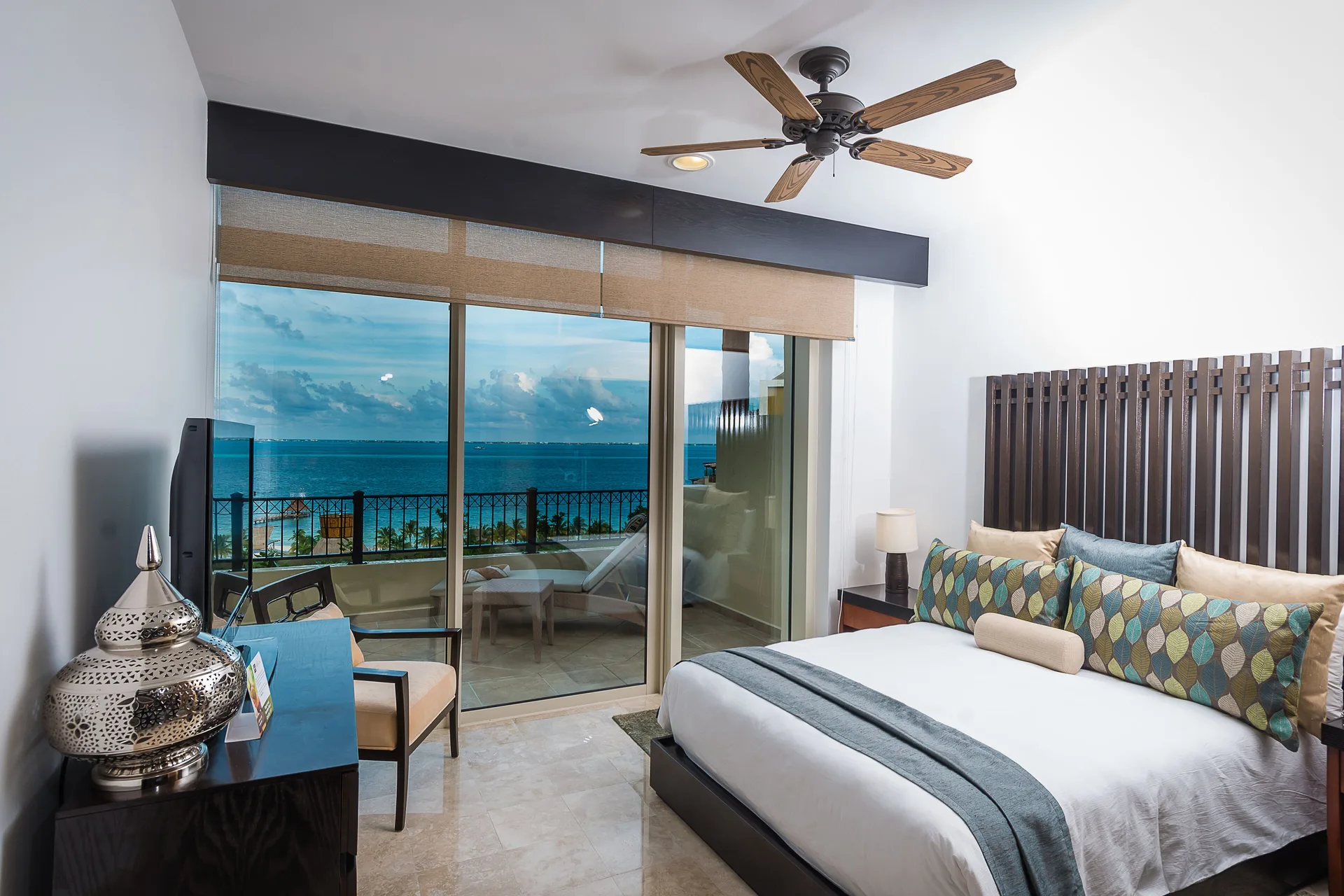 Two Bedroom Loft bedroom with king bed and balcony ocean view at Villa del Palmar Cancun Beach Resort & Spa.