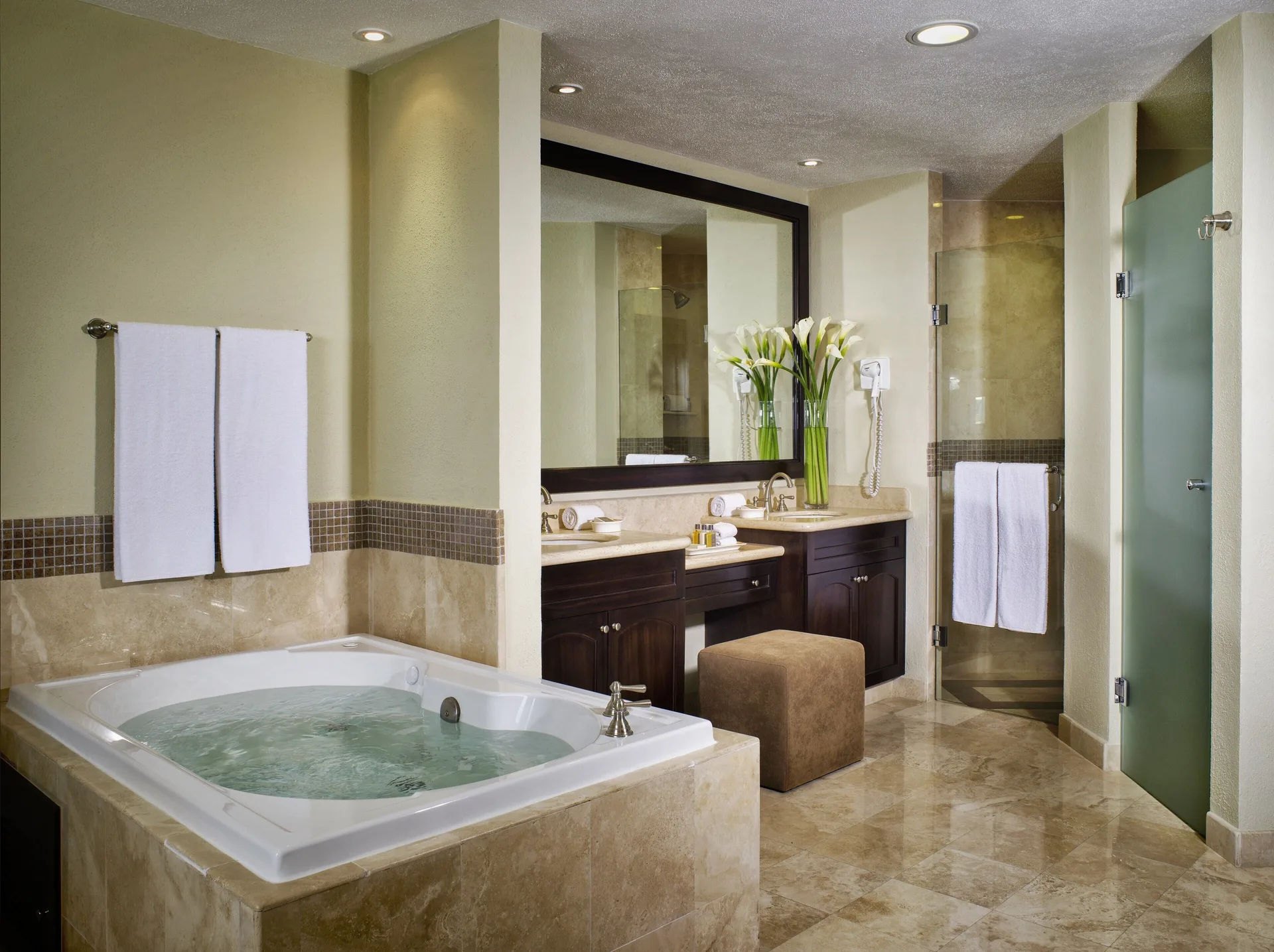Two Bedroom Ocean Front bathroom with tub and shower at Villa del Palmar Cancun Beach Resort & Spa.