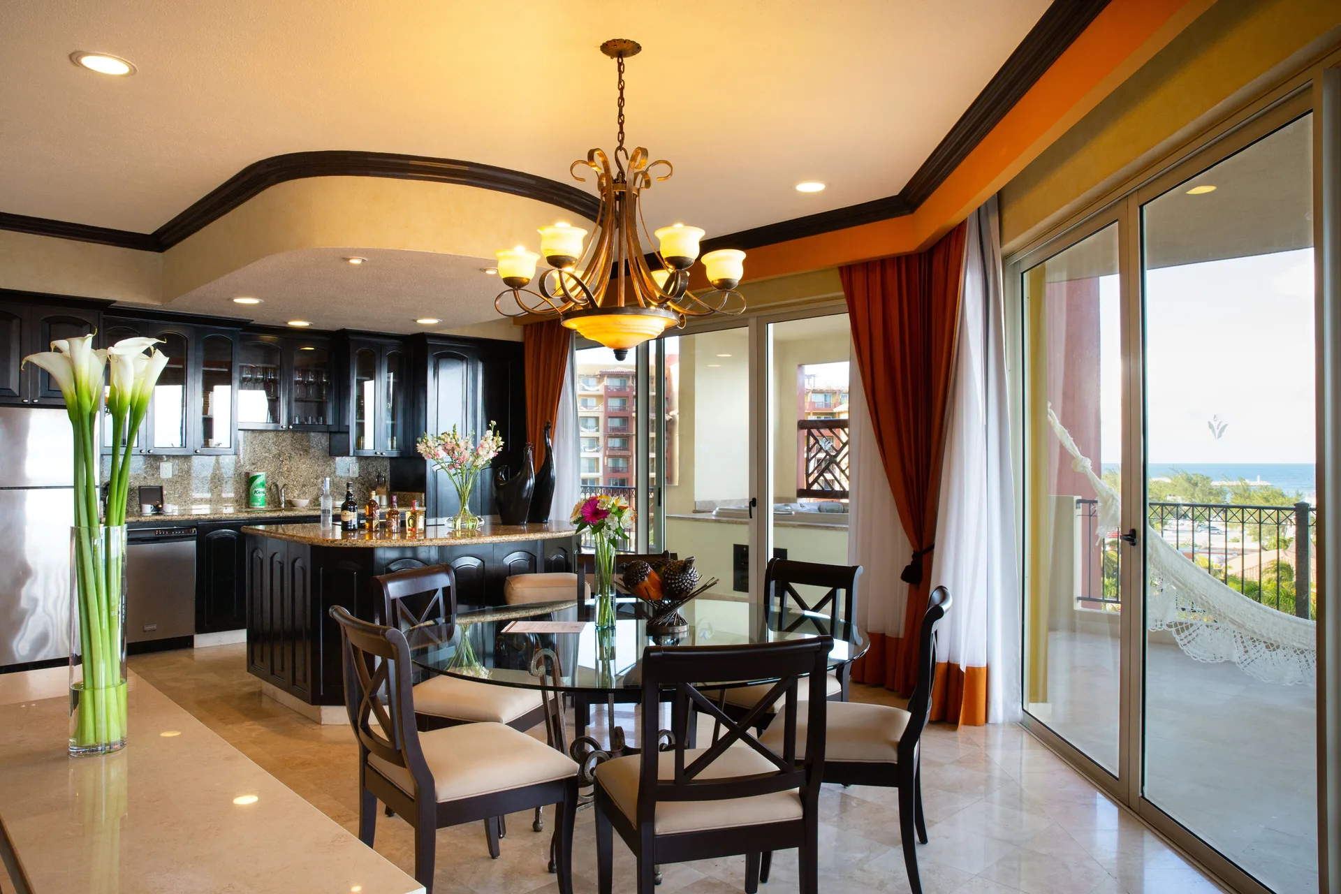 Two Bedroom Ocean Front dining area and kitchen at Villa del Palmar Cancun Beach Resort & Spa.