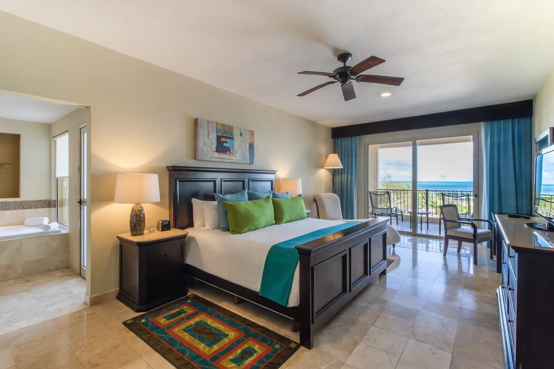Two Bedroom Ocean Front king bedroom with balcony view at Villa del Palmar Cancun Beach Resort & Spa.