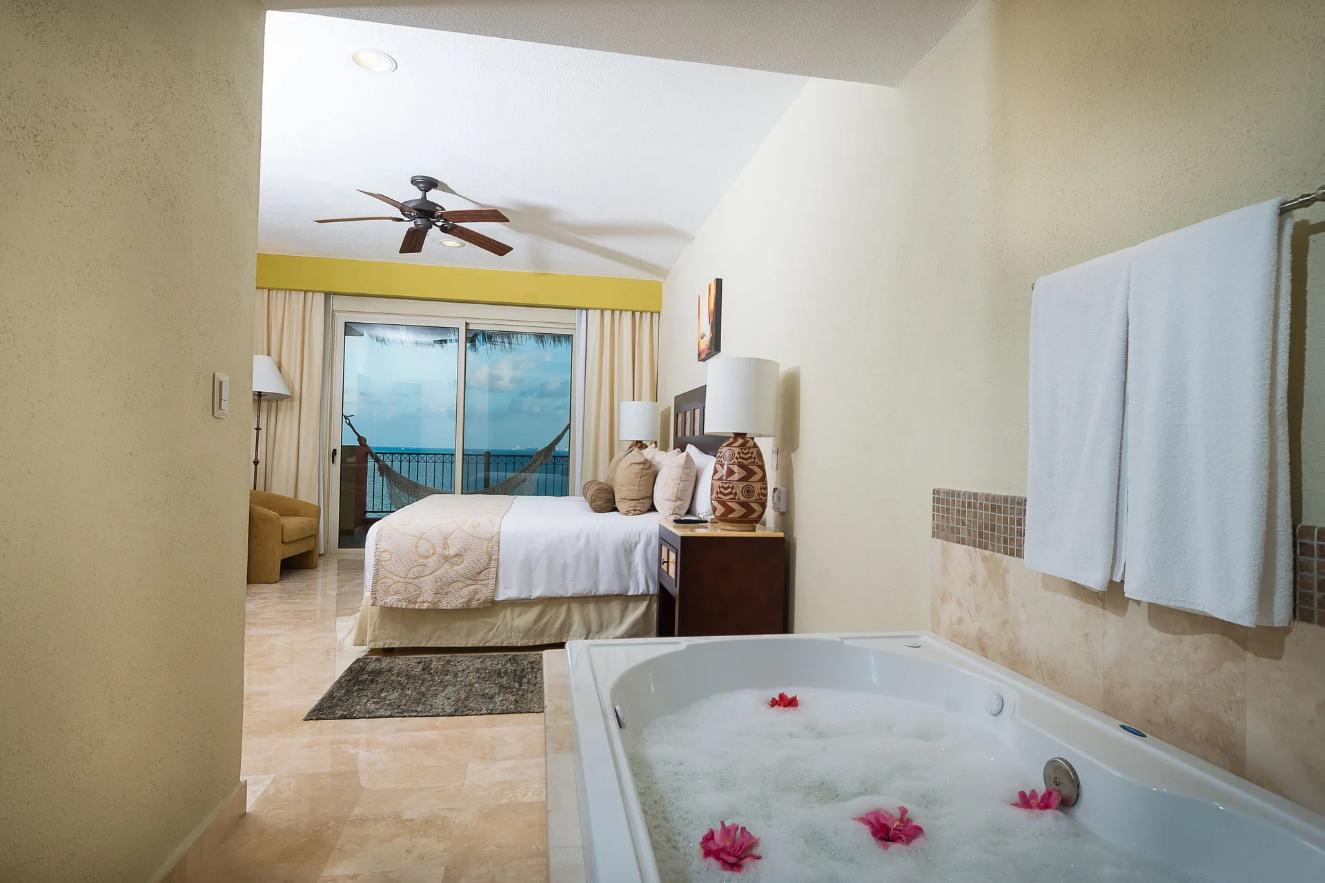 Bedroom with jetted tub in the Two Bedroom Penthouse at Villa del Palmar Cancun Beach Resort & Spa.