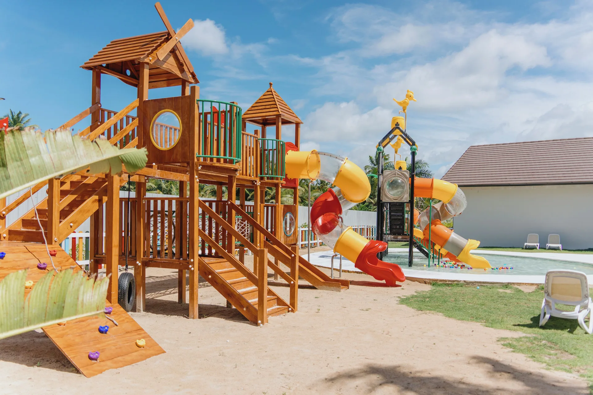 Children’s playground with slides and water play structures at Viva Miches.