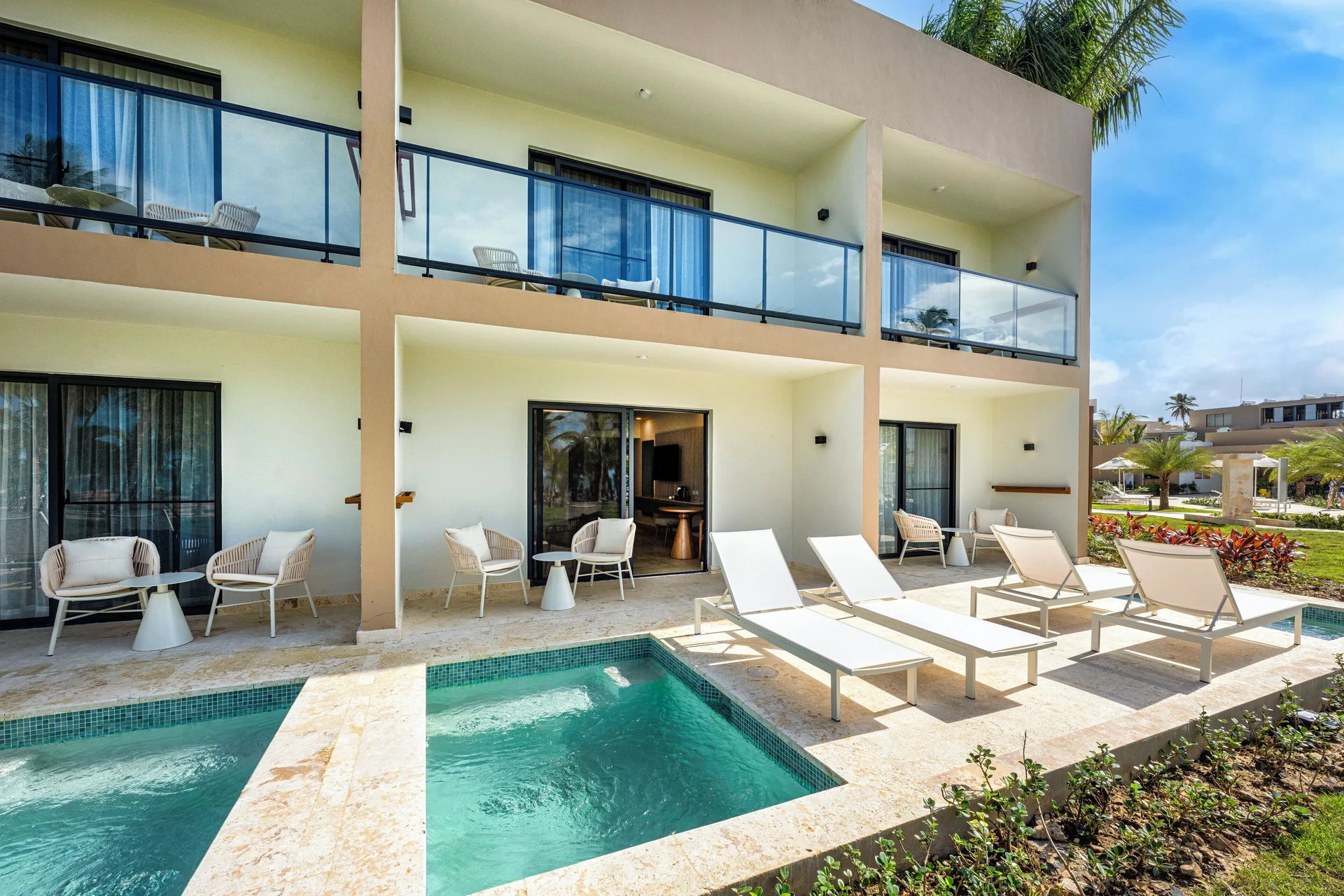Ground-floor terraces with plunge pools and loungers at Viva Miches.