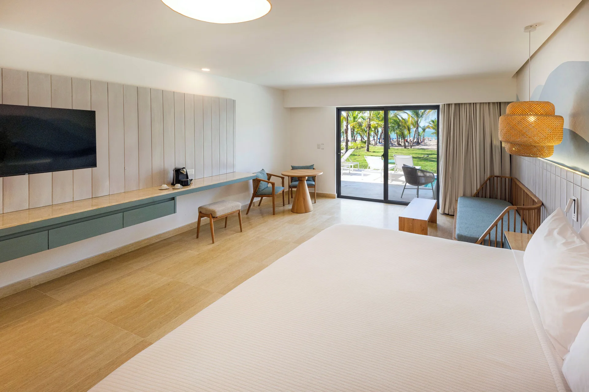 Splash Room with bed, seating, desk, and patio doors at Viva Miches.
