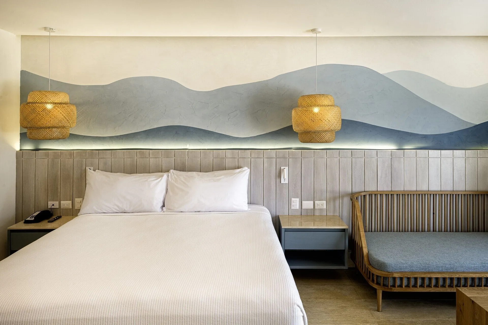 Splash Room king bed, daybed, woven pendants, and wave mural at Viva Miches.