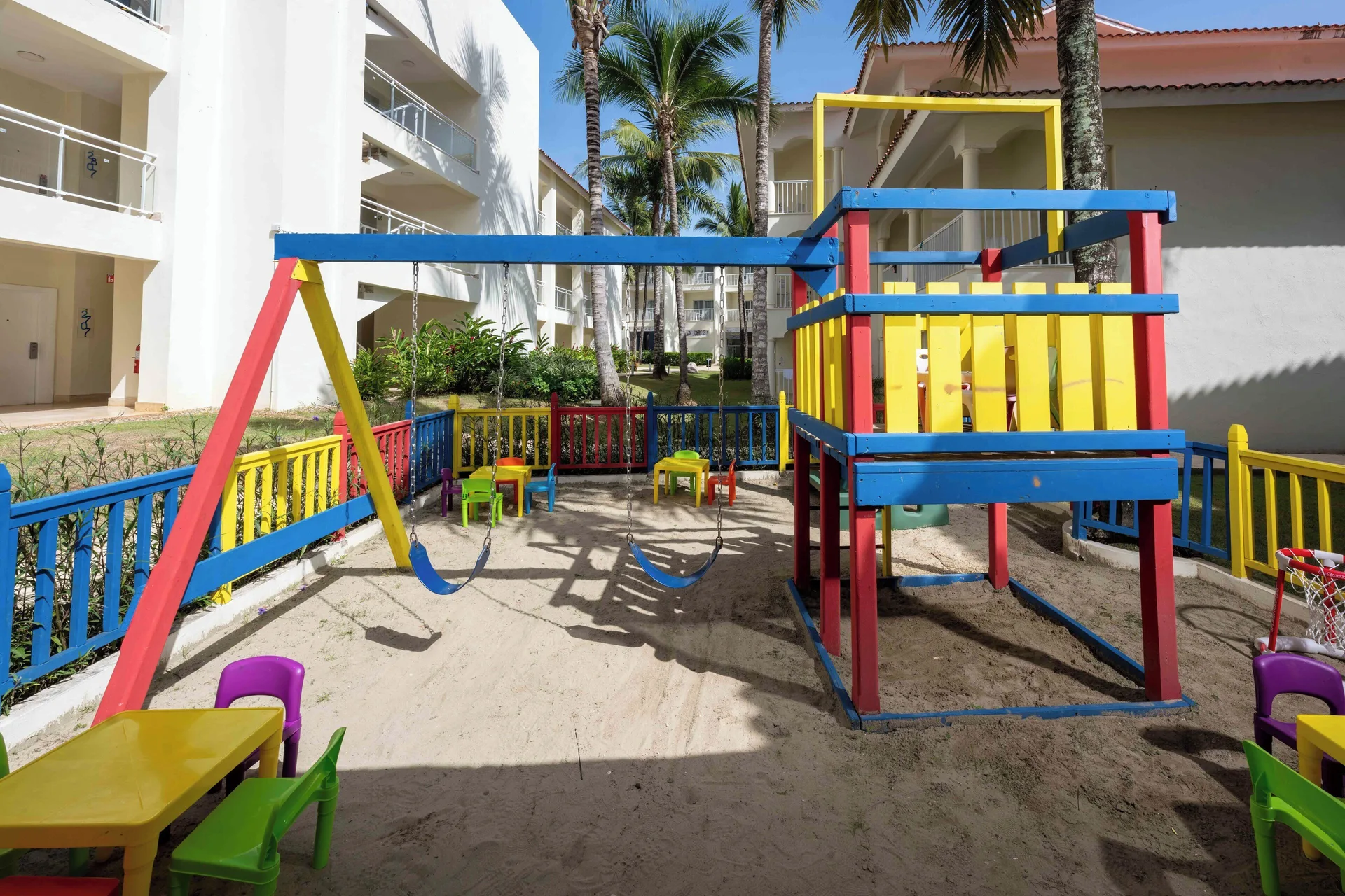 Colorful children's playground beside guest buildings at Viva Tangerine.