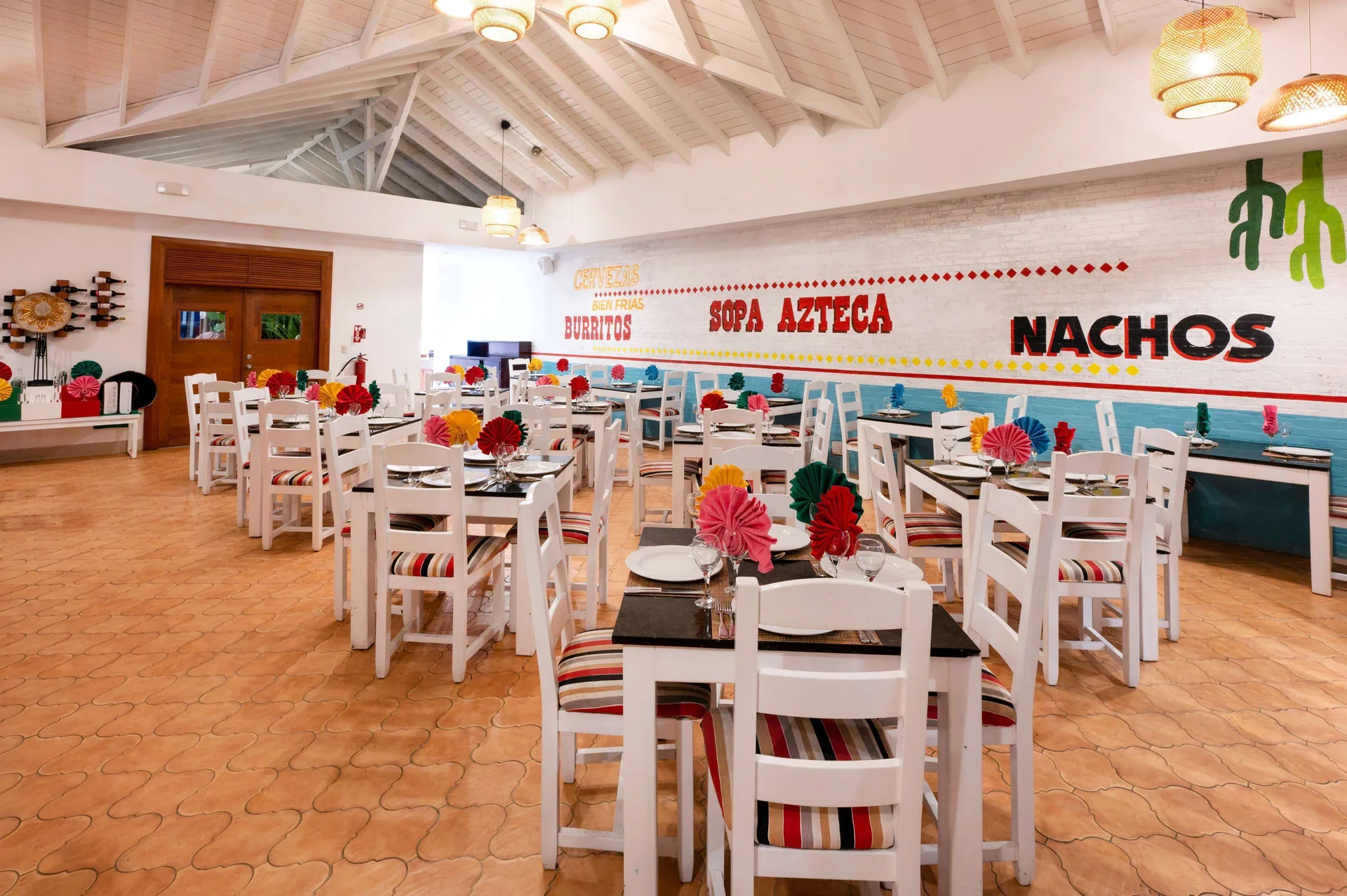 Mexican-themed dining room with colorful table decor at Viva Tangerine.