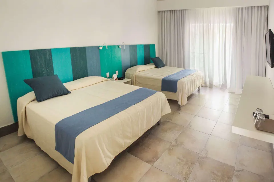 Superior Garden room with two beds, wall TV, counter, and balcony curtains at Viva Tangerine.