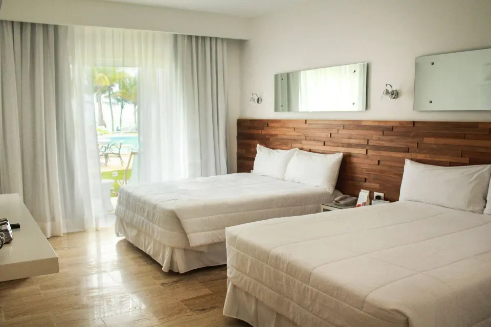 Superior Ocean room with two beds and wood headboard at Viva Tangerine.