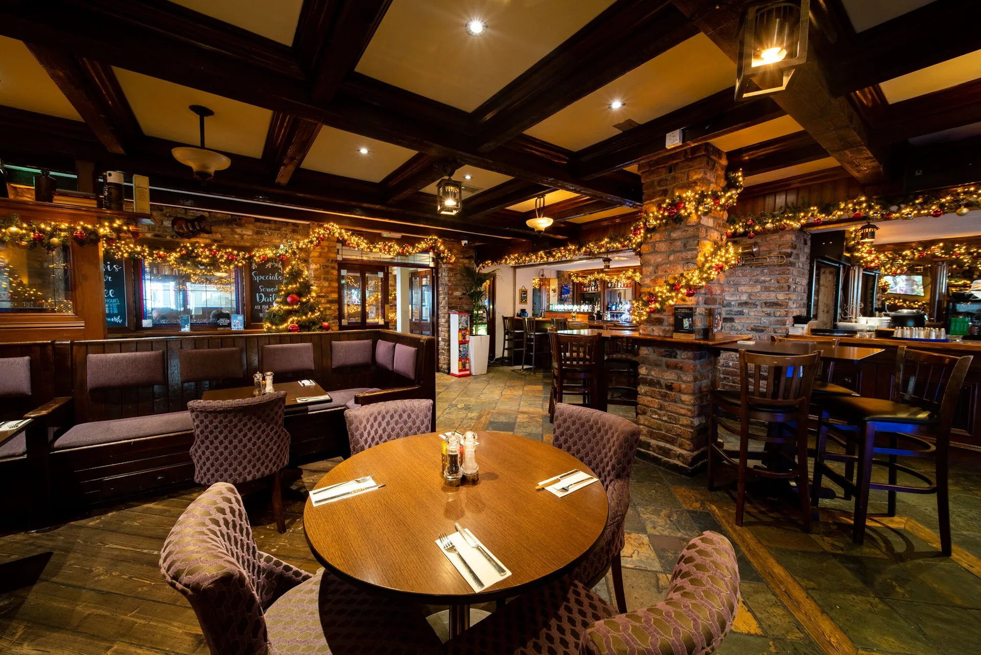 Festive pub-style bar and dining area at White Sands Hotel.